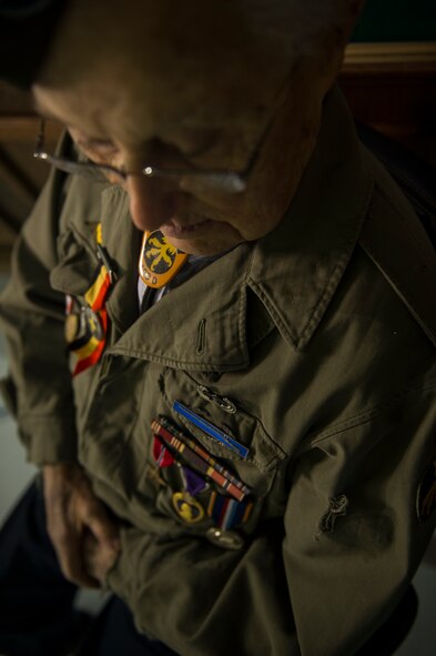 U.S. Army Private 1st Class (Sep.) Lynn Aas, 17th Airborne Division combat infantry rifleman, poses for a photo at the Dakota Territory Air Museum in Minot, N.D., Feb. 18, 2016. Aas served during the Battle of the Bulge and was awarded the Bronze Star and Purple Heart for his sacrifices. (U.S. Air Force photo/Senior Airman Apryl Hall)
