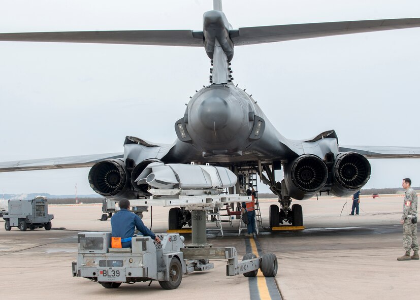 Airmen assigned to the 7th Maintenance Group load an inert Joint Air-to-Surface Standoff Missile at Dyess Air Force Base, Texas, in a B-1B Lancer Feb. 21, 2016, during a B-1 Combat Mission Effectiveness exercise. Maintenance personnel had 48 hours to successfully load and prepare to launch six B-1s with JASSM and Joint Direct Attack Munitions in the Lancers’ three bomb bays. Maintenance personnel were successful in launching all six jets and preparing themselves at the same time to deploy within the two-day window to support the aircraft. (U.S. Air Force photo by Airman 1st Class Austin Mayfield/Released)