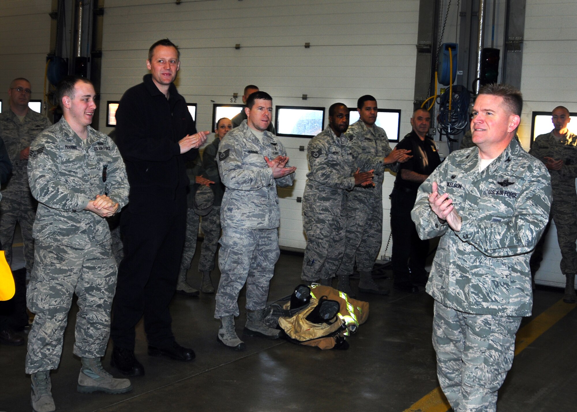 U.S. Air Force Col. Thomas D. Torkelson, 100th Air Refueling Wing, commander, speaks with members assigned to the 100th Civil Engineer Squadron fire department Feb. 29, 2016, at the base fire department, on RAF Mildenhall, England, following an announcement recognizing them as the Air Force “Chief Master Sergeant Ralph E. Sanborn” Fire Department of the Year (medium department category) for 2015. (U.S. Air Force photo by Senior Master Sgt. Brian Boisvert/Released)