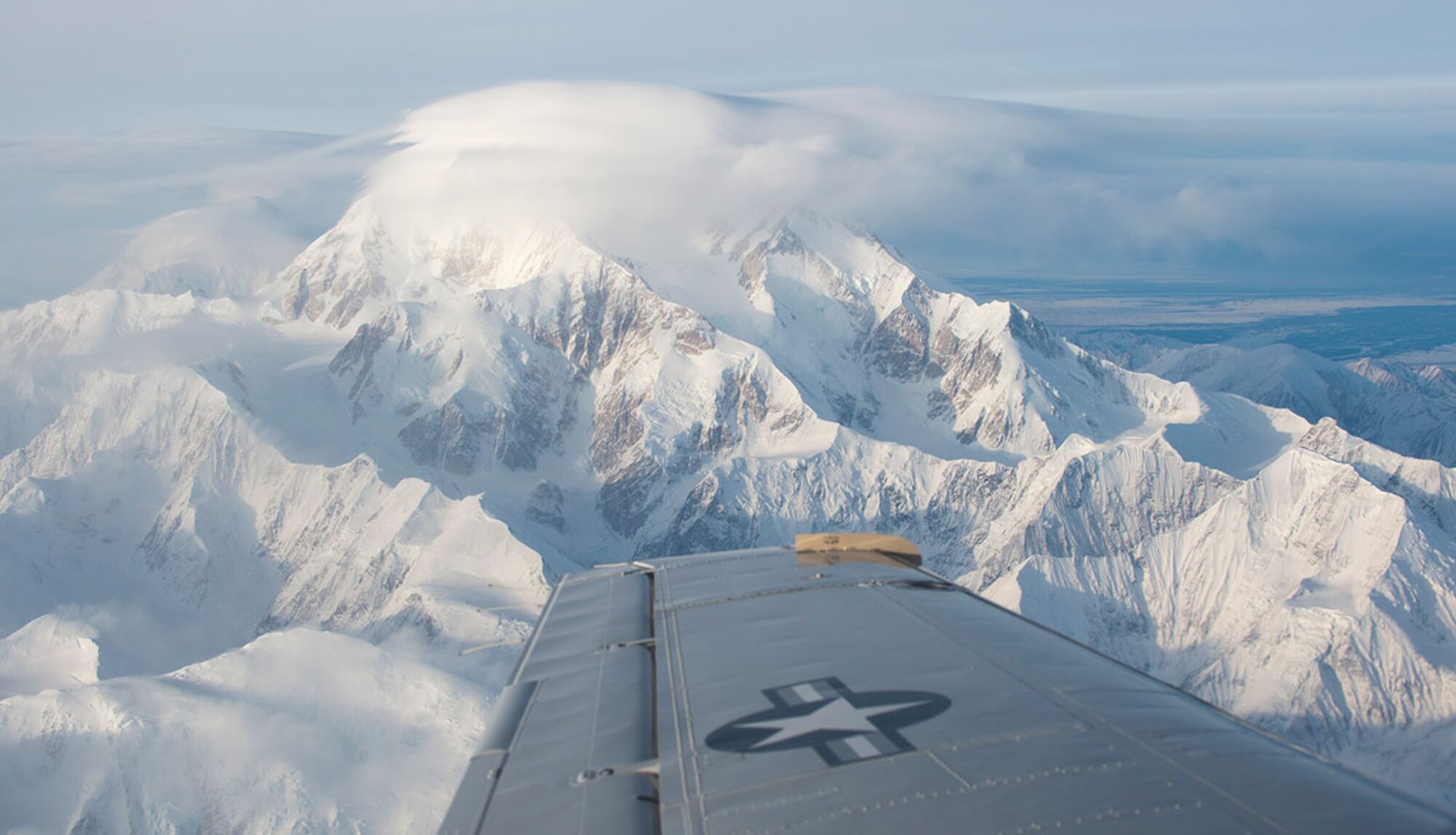 A C-12F Huron flies near Denali during a C-12 site pilot training mission visiting two remote locations in Alaska, Feb. 23, 2016. The pilots have to complete training which includes about 30 hours of flying, landing, training, and instructor-supervised landing at each of the seven remote long-range radar sites. (U.S. Air Force photo by Staff Sgt. Sheila deVera)
