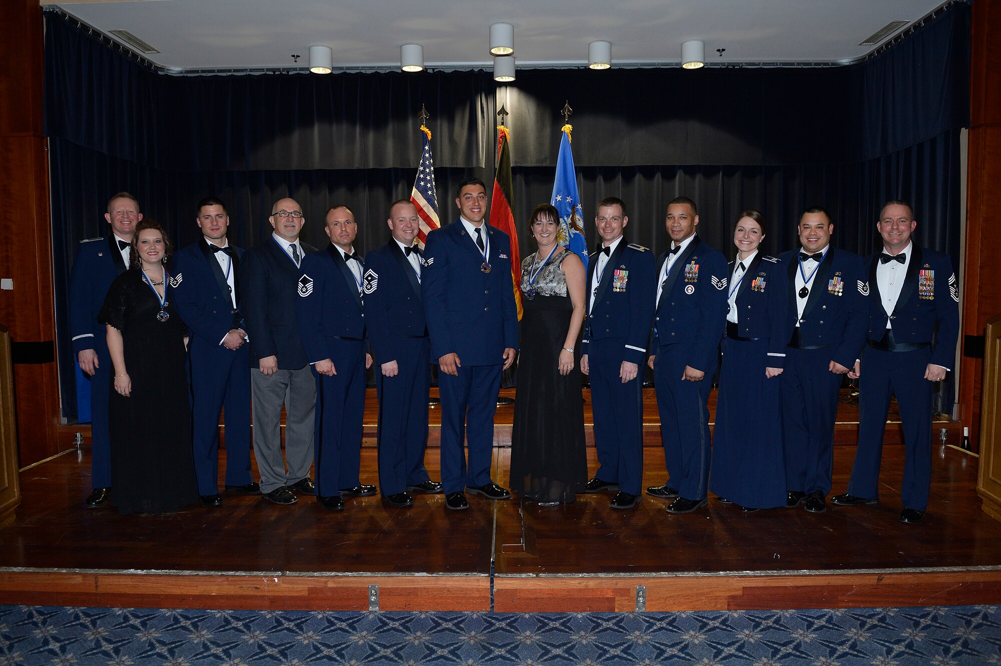 The 52nd Fighter Wing award winners pose with 52nd FW leadership after the 52nd FW 2015 Annual Awards Banquet at Club Eifel at Spangdahlem Air Base, Germany, Feb. 26, 2016. The winners earned their respective awards in recognition of excellence displayed throughout 2015. (U.S. Air Force photo by Staff Sgt. Chad Warren/Released)