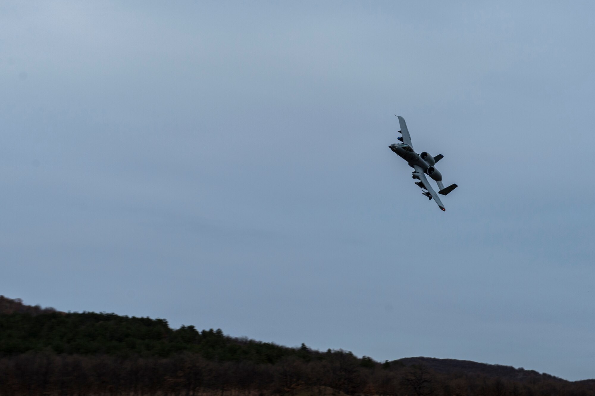 PLOVDIV, Bulgaria - A 74th Expeditionary Fighter Squadron A-10C Thunderbolt II aircraft soars through the air during combat search and rescue training near Plovdiv, Bulgaria, Feb. 11, 2016. The aircraft provided close air support for a survivor on the ground. (U.S. Air Force photo by Airman 1st Class Luke Kitterman/Released)


