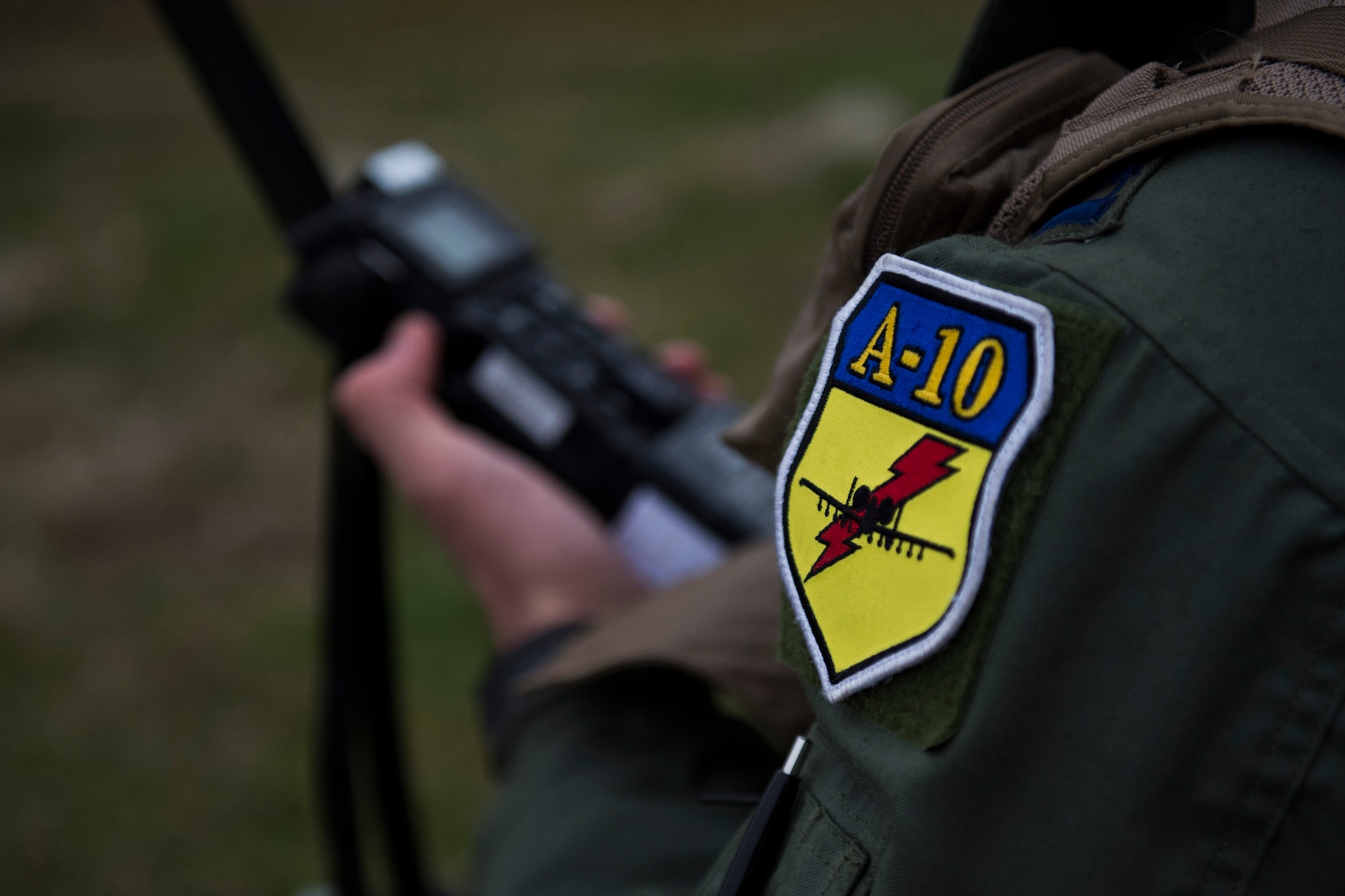 PLOVDIV, Bulgaria - A patch is displayed on the shoulder of Italian air force Captain Roberto Manzo, a 74th Expeditionary Fighter Squadron A-10C Thunderbolt II aircraft exchange pilot, during combat search and rescue training near Plovdiv, Bulgaria, Feb. 11, 2016. Manzo used a radio and played the role of ‘survivor’ during the CSAR training which involved four A-10s working together with Bulgarian Special Forces. (U.S. Air Force photo by Airman 1st Class Luke Kitterman/Released)