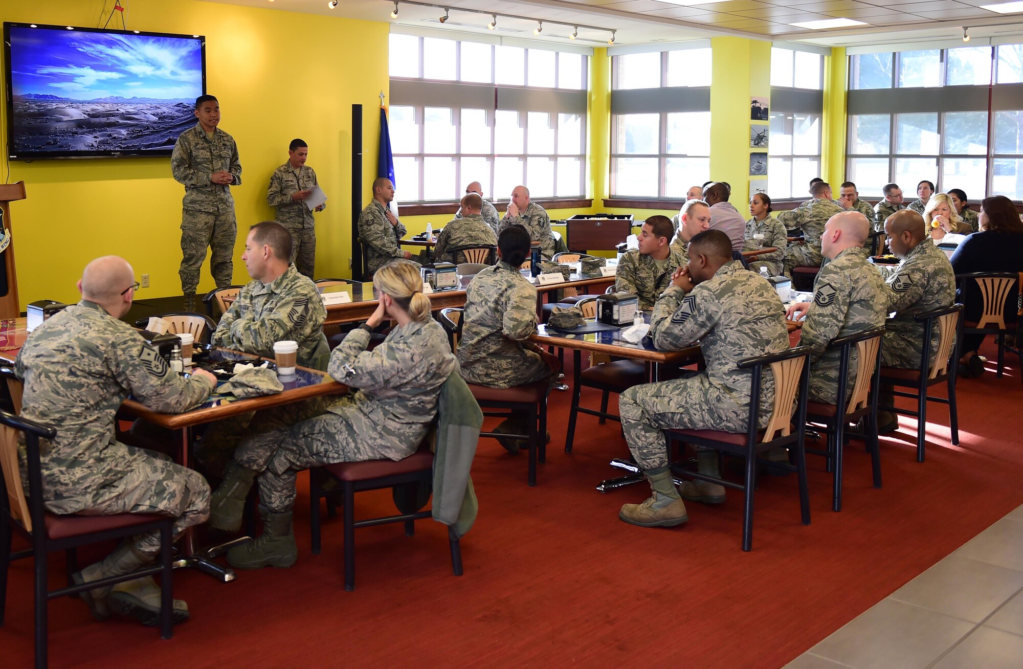 Capt. Jeric Talania, 460th Force Support Squadron deputy commander, speaks about his experience with the Air Force Assistance Fund Mar. 1, 2016, during the breakfast kickoff at the Panther Den on Buckley Air Force Base, Colo. Talania personally received support from the AFAF during the death of a family member and encouraged others to donate. (U.S. Air Force photo by Airman 1st Class Gabrielle Spradling/Released)
