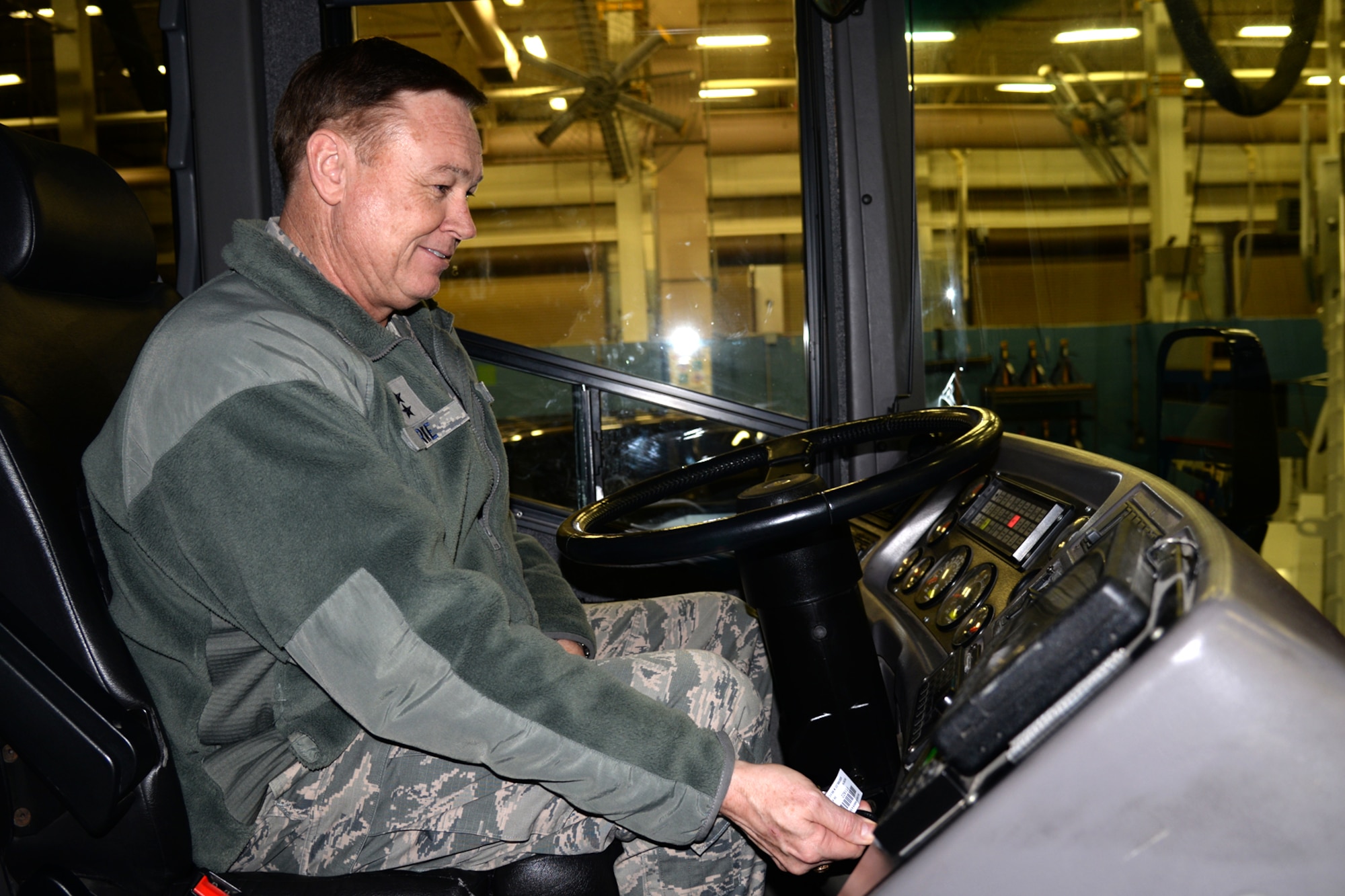 Air Force District of Washington Commander Maj. Gen. Darryl Burke visits the 11th Logistics Readiness Squadron Airmen to inspect Service Life Enhancement Program upgrades to the Coach Bus fleet on Joint Base Andrews, Md., Feb. 23, 2016. AFDW partnered with the 11th LRS to ensure funding was available to repair the buses that provide transportation for the Air Force Band and Honor Guard. (U.S. Air force photo/Tech. Sgt. Matt Davis)