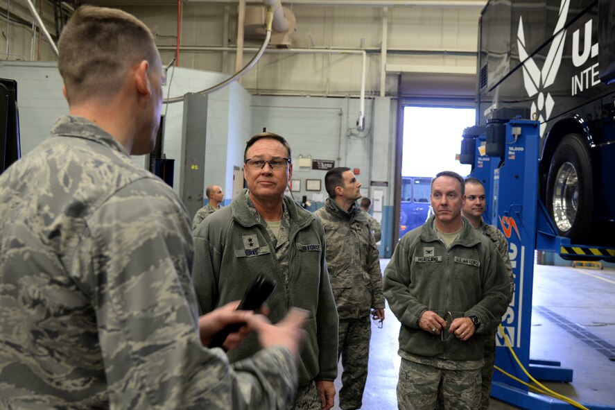 Capt. David Garcia, 11th Logistics Readiness Squadron, briefs Air Force District of Washington Commander Maj. Gen. Darryl Burke on Service Life Enhancement Program upgrades to the Coach Bus fleet on Joint Base Andrews, Md., Feb. 23, 2016. AFDW partnered with the 11th LRS to ensure funding was available to repair the buses that provide transportation for the Air Force Band and Honor Guard. (U.S. Air force photo/Tech. Sgt. Matt Davis)