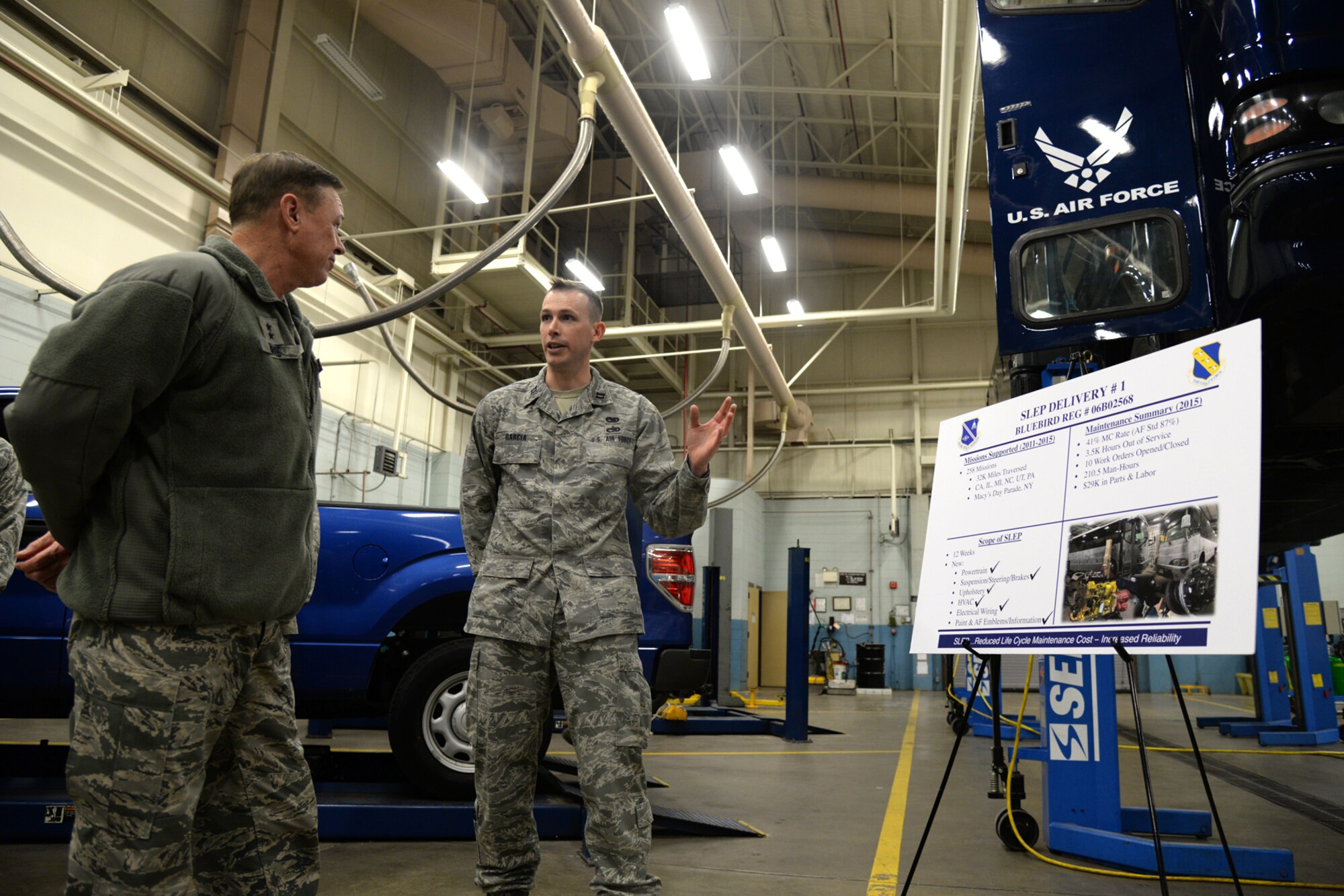 Capt. David Garcia, 11th Logistics Readiness Squadron, briefs Air Force District of Washington Commander Maj. Gen. Darryl Burke on Service Life Enhancement Program upgrades to the Coach Bus fleet on Joint Base Andrews, Md., Feb. 23, 2016. AFDW partnered with the 11th LRS to ensure funding was available to repair the buses that provide transportation for the Air Force Band and Honor Guard. (U.S. Air force photo/Tech. Sgt. Matt Davis)