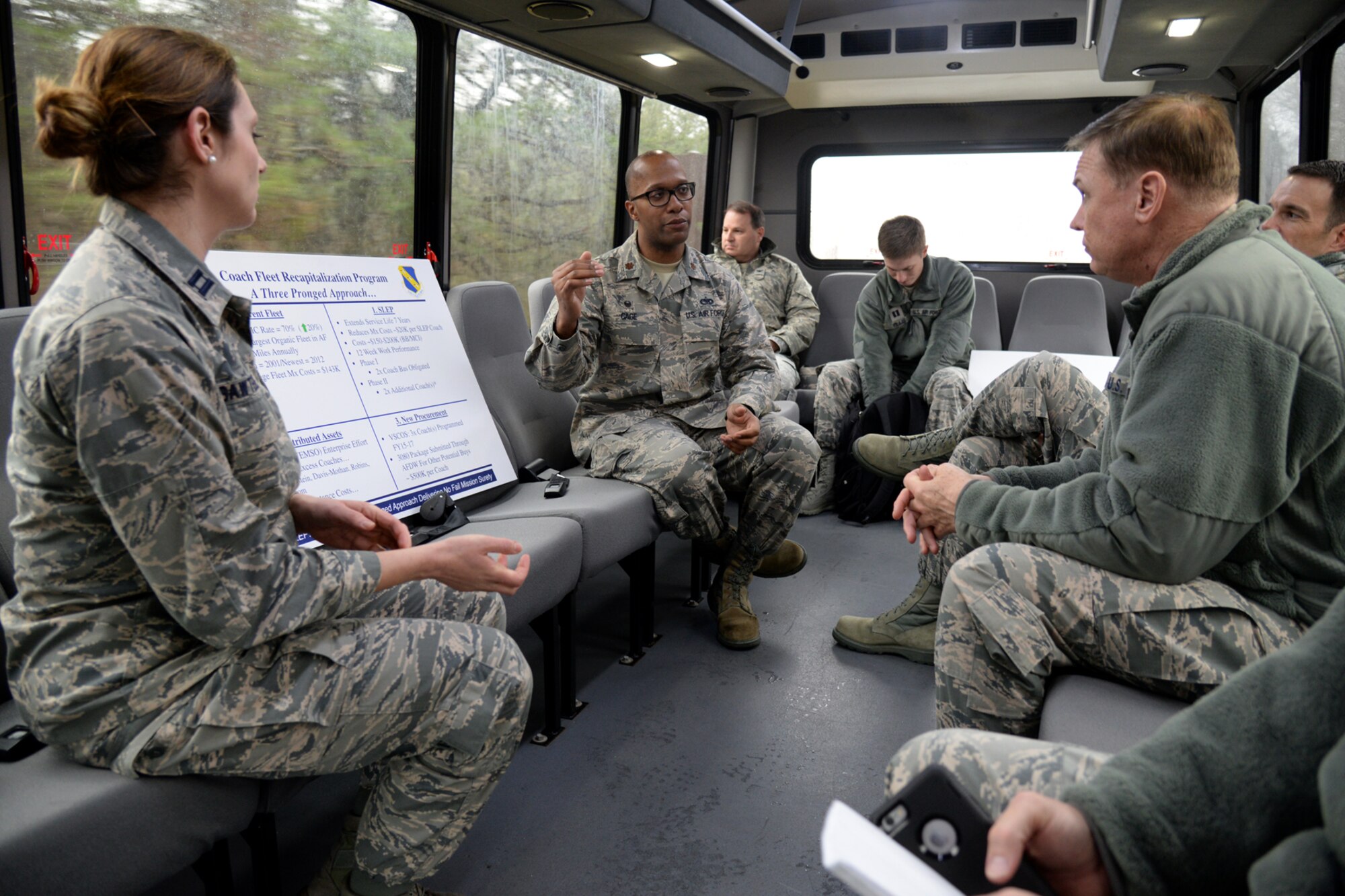 Maj. Ernest Cage, 11th Logistics Readiness squadron commander, briefs Air Force District of Washington Commander Maj. Gen. Darryl Burke on Service Life Enhancement Program upgrades to the Coach Bus fleet on Joint Base Andrews, Md., Feb. 23, 2016. AFDW partnered with the 11th LRS to ensure funding was available to repair the buses that provide transportation for the Air Force Band and Honor Guard. (U.S. Air force photo/Tech. Sgt. Matt Davis)