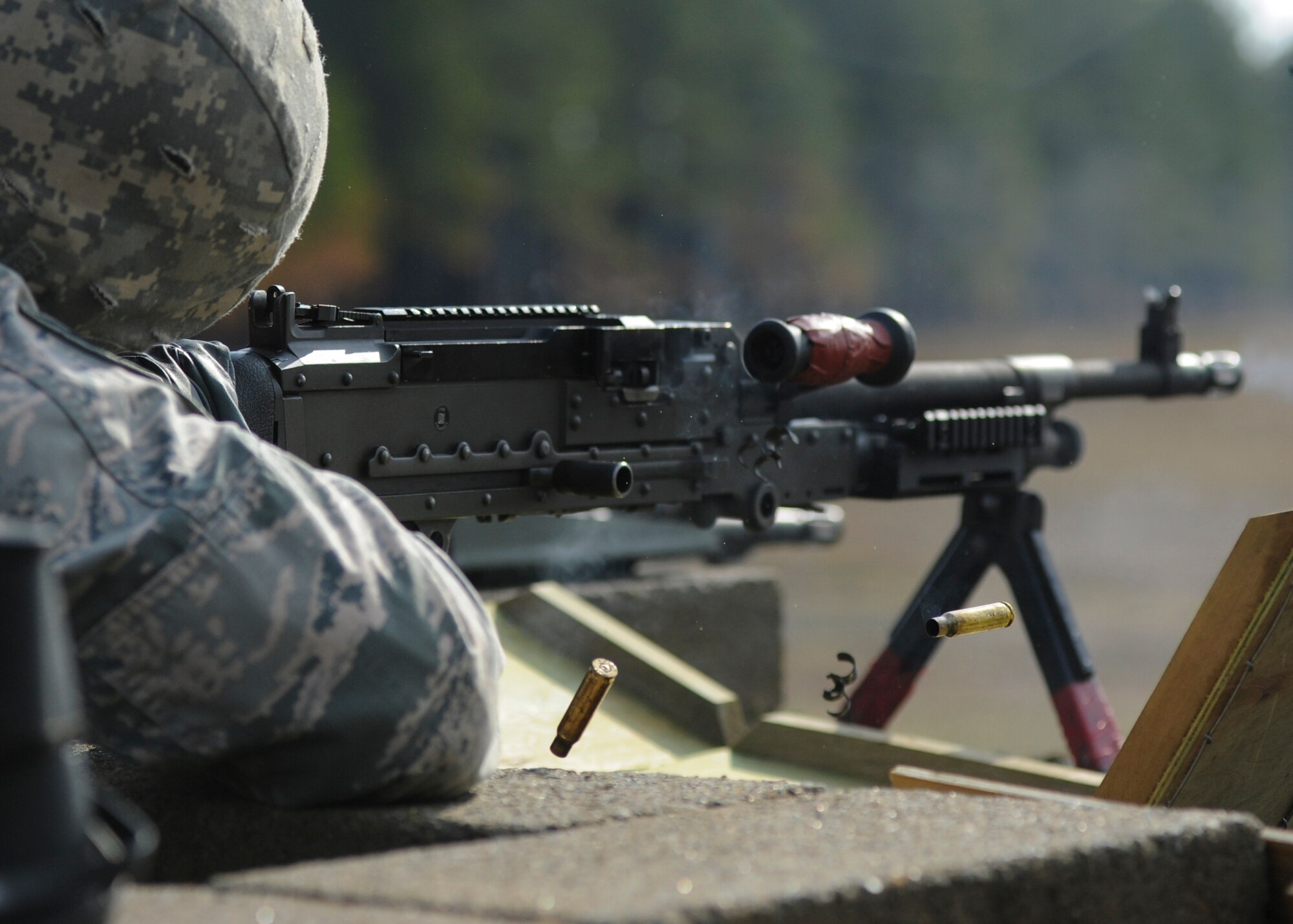 U.S. Air Force Staff Sgt. Ryan Quade, a 19th Security Forces Squadron combat arms instructor, fires an M240B machine gun Feb. 24, 2016, at Camp Joseph T. Robinson, Ark. Team Little Rock combat arms instructors routinely utilize nearby Army posts to qualify on a variety of weapons. (U.S. Air Force photo/ Senior Airman Harry Brexel)