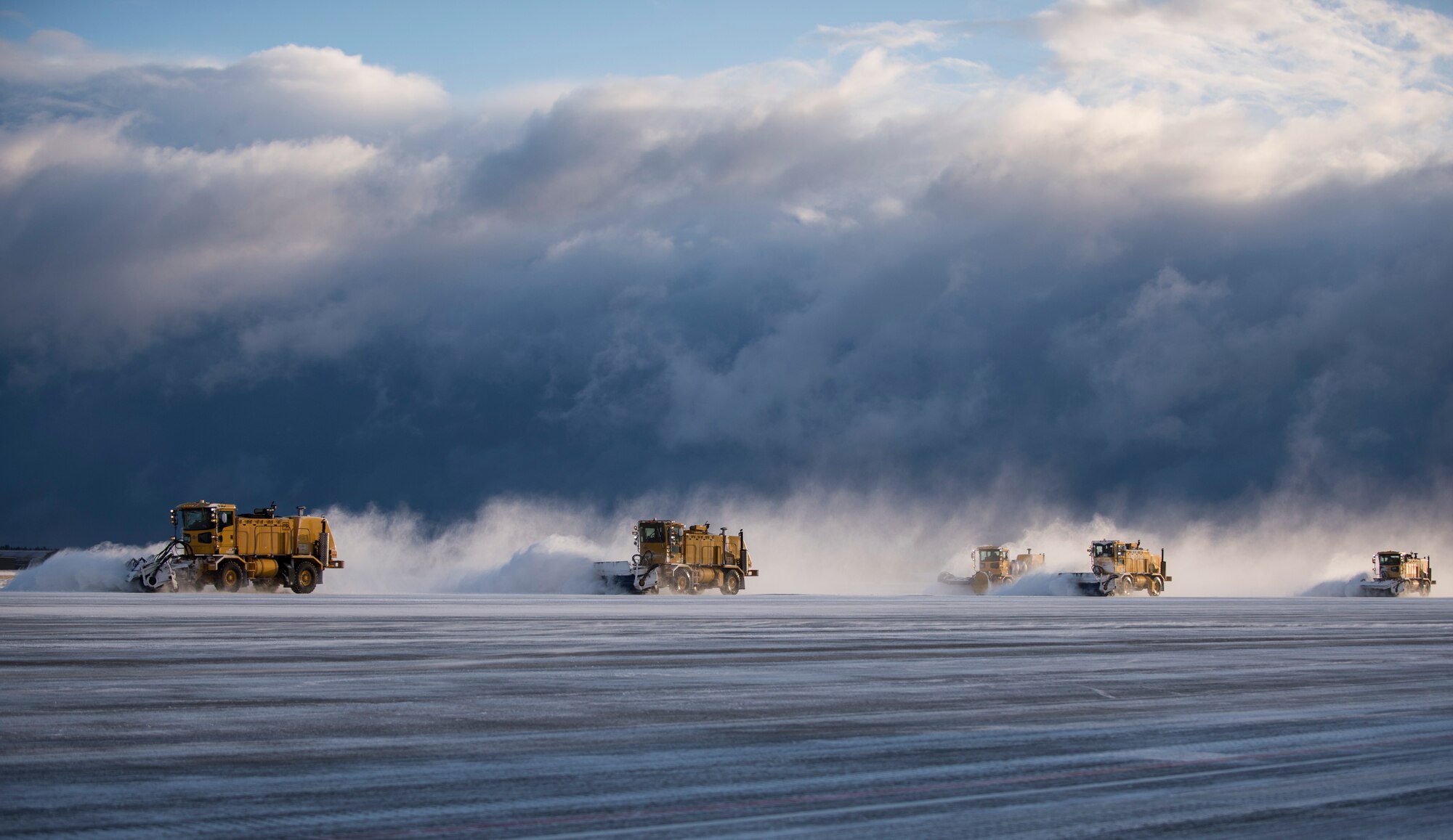 Members from 35th Civil Engineer Squadron operate air blast sweepers on the runway at Misawa Air Base, Japan, Feb. 24, 2016. These 35th CES Airmen make sure the flying mission can be carried out and the base populous is able to safely commute from point A to point B during the winter. (U.S. Air Force photo by Senior Airman Brittany A. Chase)