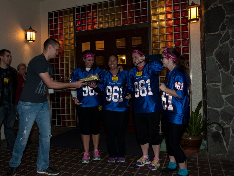 Spouses from the 961st Airborne Air Control Squadron receive the first place prize during Team Kadena Spouses’ Amazing Race Feb. 25, 2016, at Kadena Air Base, Japan. The race featured three days of intense competition among the spouses. (U.S. Air Force photo by Airman 1st Class Lynette M. Rolen)