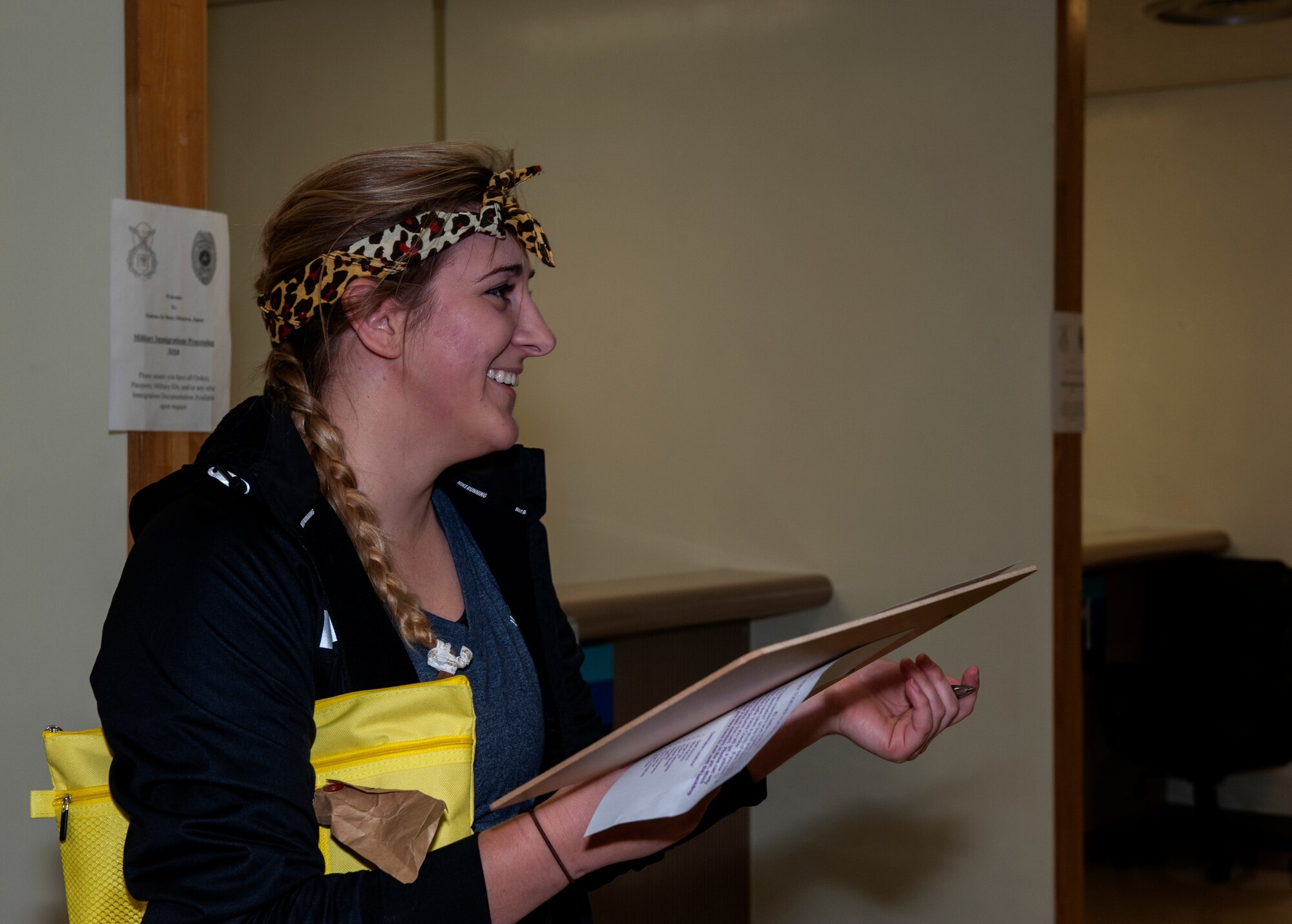 Stephanie Brent, 44th Fighter Squadron spouse, encourages her teammate during Team Kadena Spouses’ Amazing Race Feb. 25, 2016, at Kadena Air Base, Japan. One of the challenges consisted of searching for names on a manifest that had been dispersed throughout a room. Competitors could only whisper to their teammates throughout this challenge. (U.S. Air Force photo by Airman 1st Class Lynette M. Rolen)