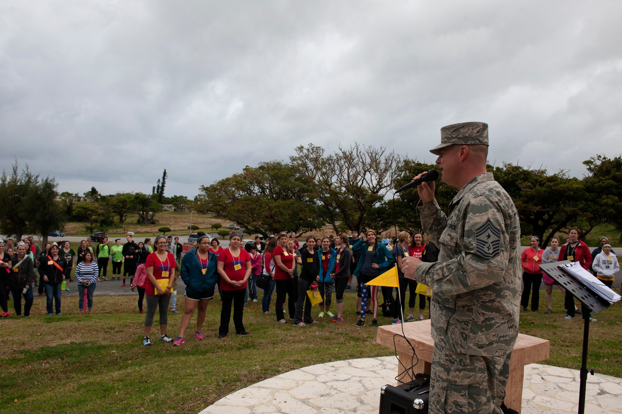 U.S. Air Force Chief Master Sgt. Charles Hoffman, 18th Wing command chief master sergeant, speaks to spouses at the opening ceremony for Team Kadena Spouses’ Amazing Race Feb. 23, 2016, at Kadena Air Base, Japan. The race consisted of multiple events that tested the competitors in different ways. (U.S. Air Force photo by Airman 1st Class Lynette M. Rolen)