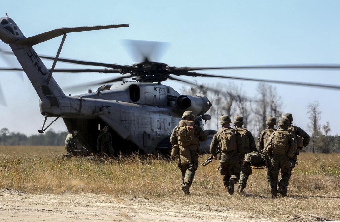Marines with India Company, 3rd Battalion, 6th Marine Regiment, conduct a simulated casualty evacuation as part of Exercise Eager Response at Fort Stewart, Ga., Feb. 26, 2016. The battalion conducted the training with the support of a CH-53E Super Stallion operated by Marines with Marine Heavy Helicopter Squadron 366. During Exercise Eager Response, Marines trained in events such as casualty evacuation, assault support missions and aerial refueling, proving the Marine Air-Ground Task Force is a highly effective combat force.