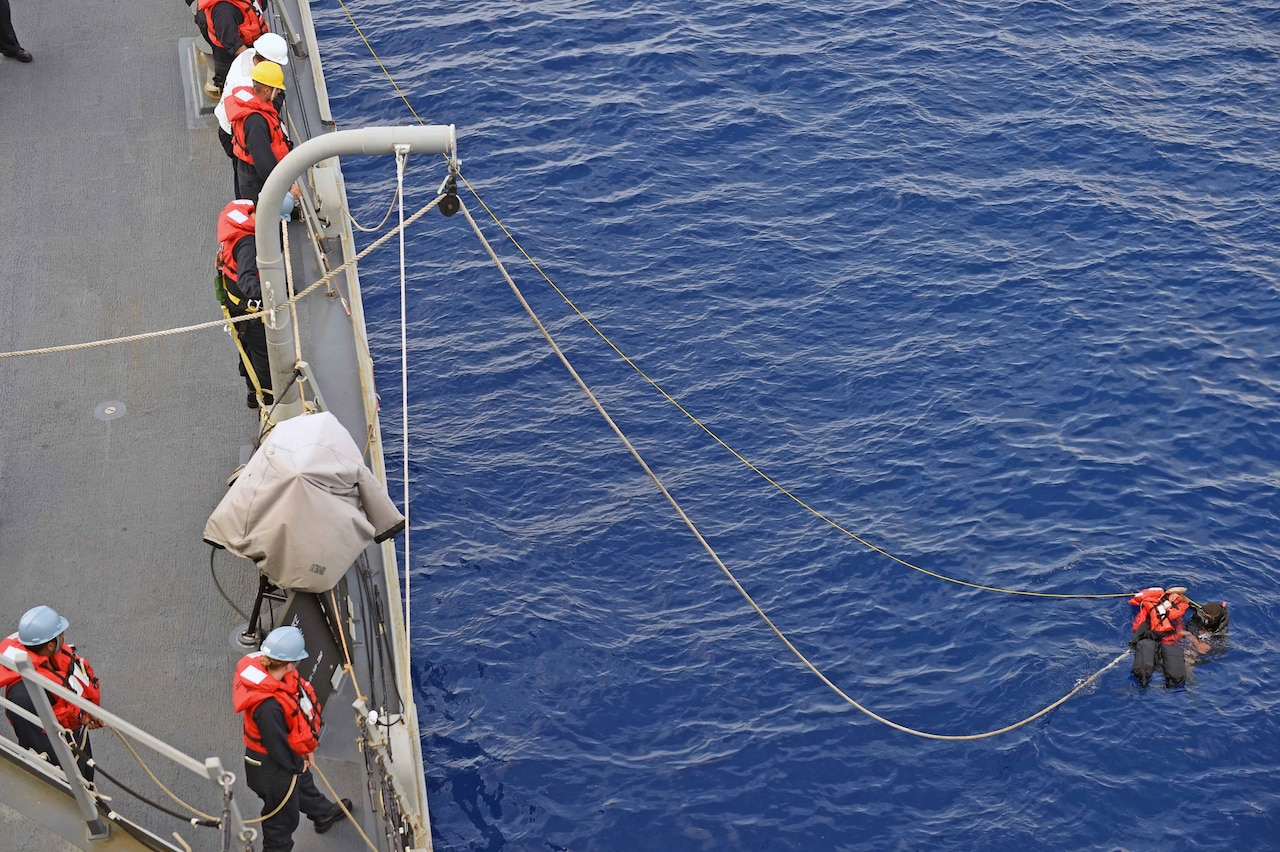 160125-N-KM939-603
PACIFIC OCEAN (Jan. 25, 2016) - Seaman Steve Martinez, from Pueblo, Colorado, saves “Oscar,” the rescue dummy, during a man overboard drill on the guided-missile destroyer USS Stockdale (DDG 106). Providing a ready force supporting security and stability in the Indo-Asia-Pacific, Stockdale is operating as part of the John C. Stennis Strike Group and Great Green Fleet on a regularly scheduled 7th Fleet deployment. (U.S. Navy photo by Mass Communication Specialist 3rd Class David A. Cox/Released)