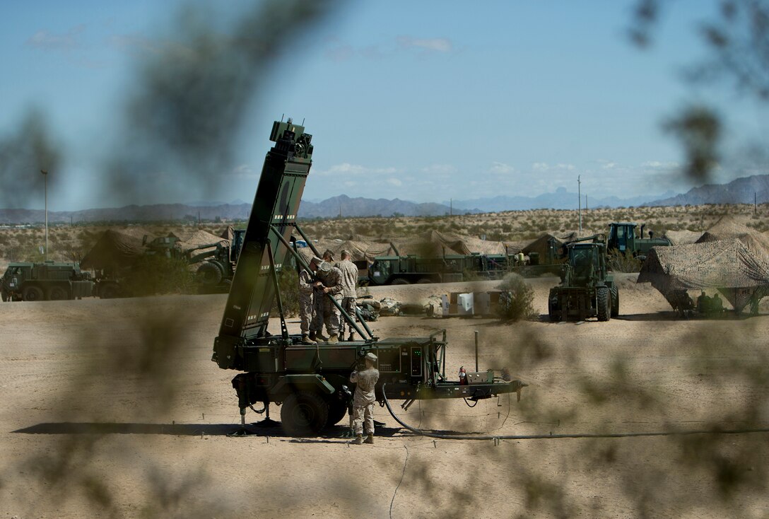 Marine Corps radar technicians with the Early Warning Control Crew install the arms of the Ground/Air Task Oriental Radar during a Weapons and Tactics Instructor Course exercise Sept. 16, 2015, at Cannon Air Defense Complex (P111), Yuma, Ariz. G/ATOR is a next-generation radar that provides air surveillance/air defense, counter-fire target acquisition, and air traffic control capabilities. The G/ATOR team at Program Executive Officer Land Systems recently received the Defense Department’s David Packard Award in Acquisition Excellence for their efforts to get the system ready for fielding. (U.S. Marine Corps photo by Cpl. Summer Dowding)