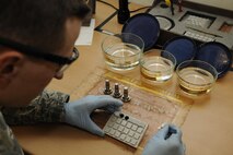 Staff Sgt. John Stevens, 8th Maintenance Squadron non-destructive inspection shift supervisor, prepares magnetic chip detectors for analysis March 2, 2016, at Kunsan Air Base, Republic of Korea. The 8th MXS NDI shop inspects metal objects ranging from nuts and bolts, to large hooks and sheets of metal to ensure the safety of the aicraft. (U.S. Air Force photo/Senior Airman Dustin King)