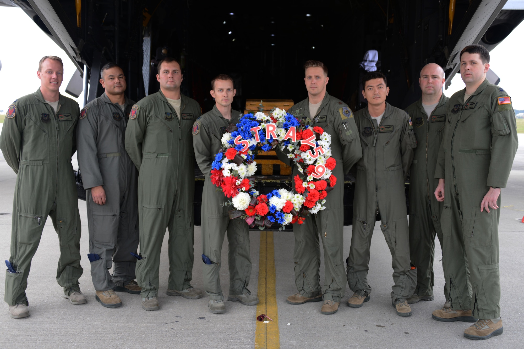 Members of the 1st Special Operations Squadron pose with a wreath that will be dropped from a U.S. Air Force MC-130H Combat Talon II special operations aircraft to memorialize Stray 59 on Feb. 26, 2016. Stray 59 was a 1st SOS U.S. Air Force MC-130E Combat Talon I special operations aircraft that went down in 1981 over Subic Bay, Philippines, during a training mission. (U.S. Air Force photo by Master Sgt. Kristine Dreyer, 353rd Special Operations Group Public Affairs)