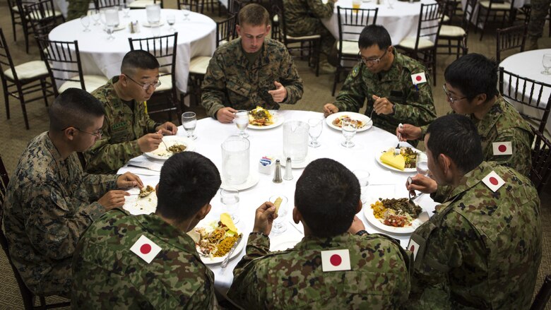 U.S. Marines and Japanese Ground Self-Defense Force soldiers dine together during the closing ceremony of exercise Iron Fist 2016 at Marine Corps Base Camp Pendleton, California, March 1, 2016. Exercise Iron Fist brought together Marines and JGSDF soldiers to hone their ability to conduct combined amphibious operations to help preserve peace and prevent conflict in the Asia-Pacific Region.