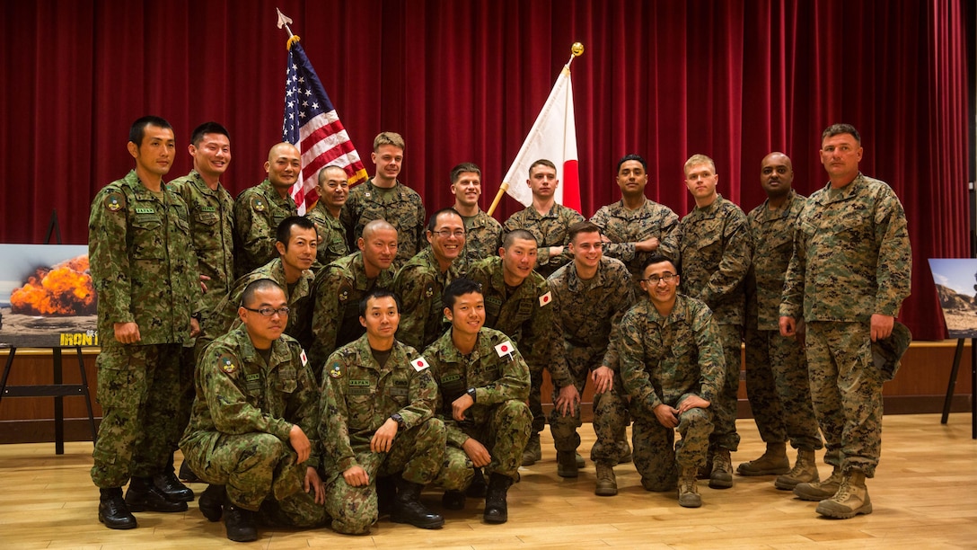 U.S. Marines and Japan Ground Self-Defense Force soldiers pose for a group photograph at Marine Corps Base Camp Pendleton, California, March 1, 2016, after the closing ceremony of Exercise Iron Fist 2016. The ceremony concluded the 11th iteration of Exercise Iron Fist, an annual, bilateral amphibious training exercise designed to improve the USMC and JGSDF ability to plan, communicate and conduct combined amphibious operations.