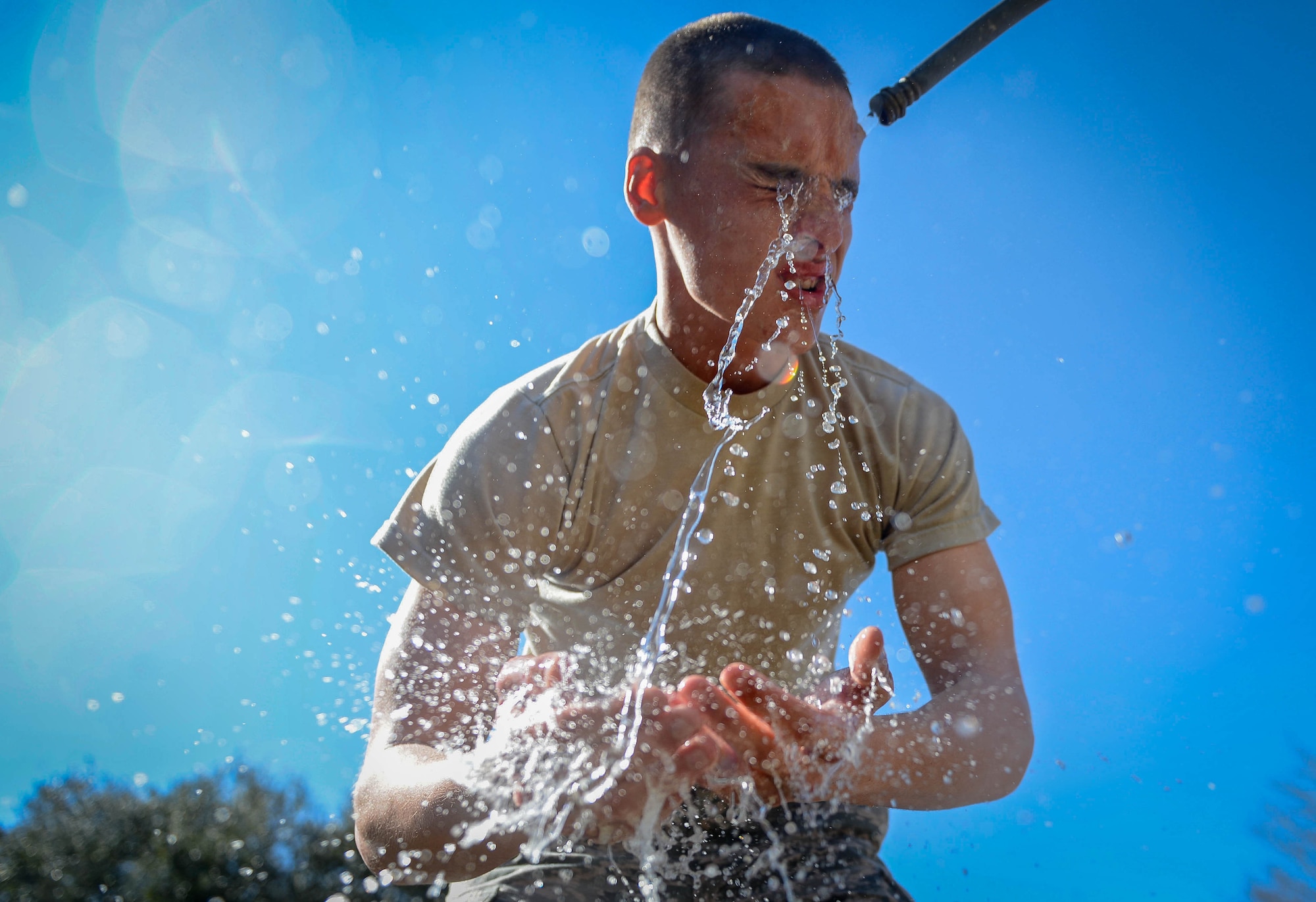 Members of the 20th Security Forces Squadron participate in pepper spray training at Shaw Air Force Base, S.C., Feb. 29, 2016. After pepper spray exposure, Airmen had to detain a simulated perpetrator at four separate stations. (U.S. Air Force photo by Senior Airman Jensen Stidham) 