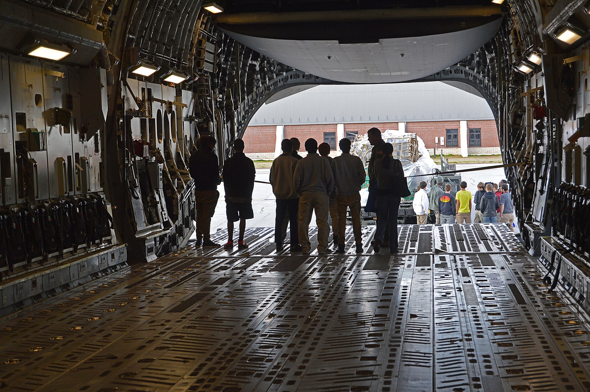 Master Sgt. Tim Schnaible, 300th Airlift Squadron loadmaster, explains to students how cargo is loaded onto a C-17 Globemaster III  at the Joint Base Charleston Tuskegee Airmen Career Day Feb. 25, 2016. The 315th Airlift Wing's first Tuskegee Airmen Career Day drew  over 130 local teenage boys to Joint Base Charleston, S.C. to learn about careers in aviation. The event also celebrated the story of the first black pilots in the American military – the Tuskegee Airmen. (courtesy photo by Senior Master Sgt. Eric Keys)
