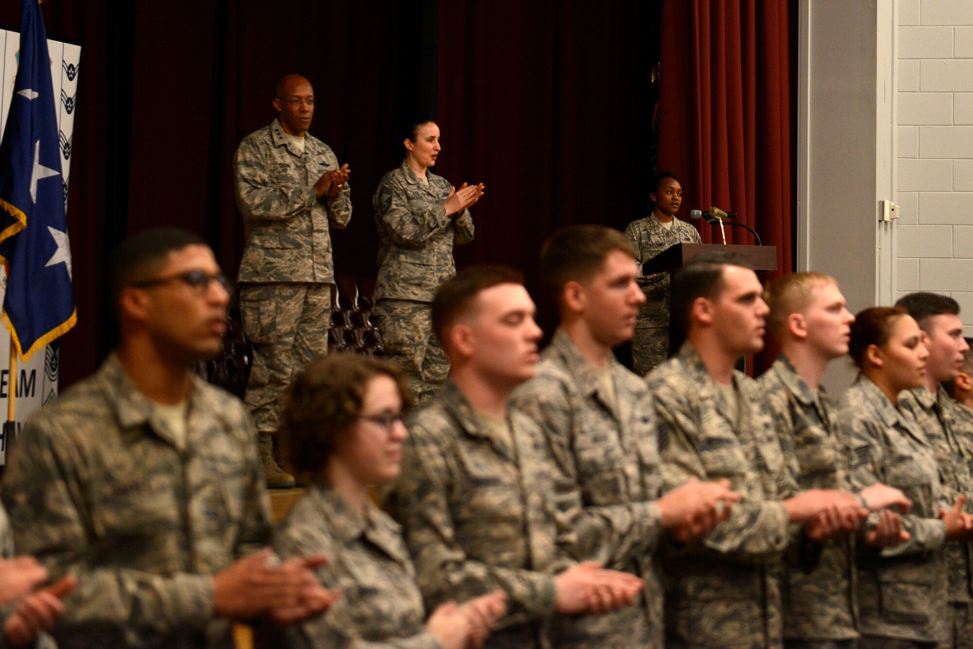 U.S. Air Force Lt. Gen. Charles Q. Brown Jr., commander, U.S. Air Forces Central Command, and Chief Master Sgt. Summer Leifer, AFCENT chief enlisted manager, celebrate with promotees at the end of a promotion ceremony at Shaw Air Force Base, S.C., Feb. 29, 2016. The ceremony concluded with the singing of the Air Force song, followed by congratulatory remarks to the newly promoted Airmen. (U.S. Air Force photo by Airman 1st Class Christopher Maldonado) 