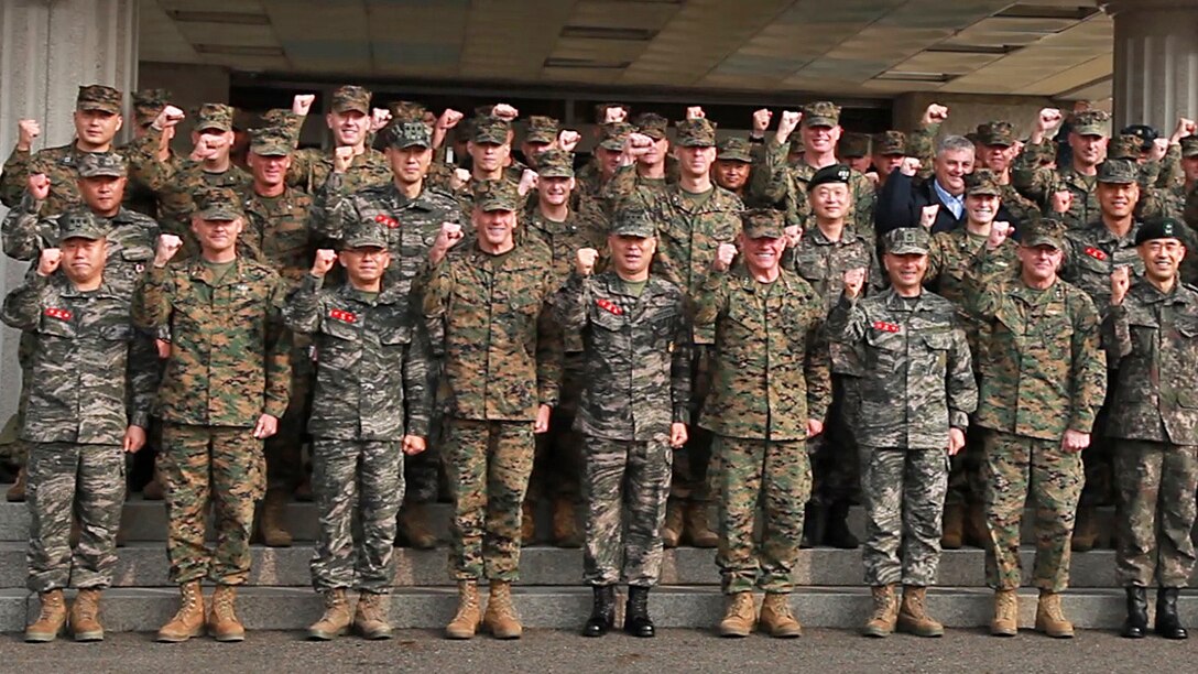 U.S. and Republic of Korea Marines shout "We go together!" Feb. 23, 2016, at the ROK Marine Corps Headquarters in Baran, South Korea. More than 60 Marines and sailors with III MEF, III MEF subordinate commands and adjacent commands based in Japan and South Korea, met in the South in order to uphold and strengthen the alliance between the ROK and the U.S., and reinforce their commitment to defend the country at a moment’s notice. The visit took place in various locations throughout the country, enhancing U.S. Marines' familiarization of the Korean Peninsula while simultaneously developing the kind of faith and trust between forces that can only be established through constant engagement, as well as rigorous and realistic training.