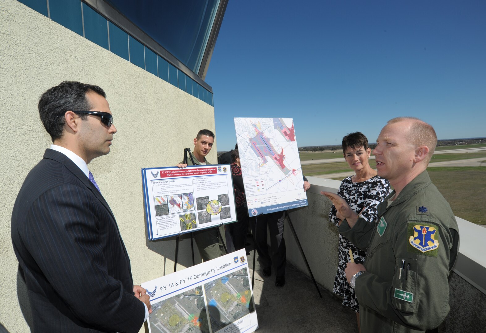 Texas Land Commissioner George P. Bush, Texas Sen. Donna Campbell and Lt. Col. Emil Bliss, 12th Flying Training Wing Community Initiatives director, discuss encroachment issues at an air traffic control tower Feb. 24 at Joint Base San Antonio-Randolph. 