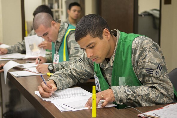 Airmen from the 7th Bomb Wing man the Deployment Control Center processing line Feb. 23, 2016, at Dyess Air Force Base, Texas, during a B-1 Combat Mission Effectiveness exercise. The DCC is a one-stop shop for Airmen issued a short-notice deployment tasking to ensure they are fully qualified to deploy. Part of the plan for the B-1 CME exercise was to task Airmen in operations, maintenance and support positions to deploy within 48 hours. (U.S. Air Force photo by Airman 1st Class Austin Mayfield/Released)