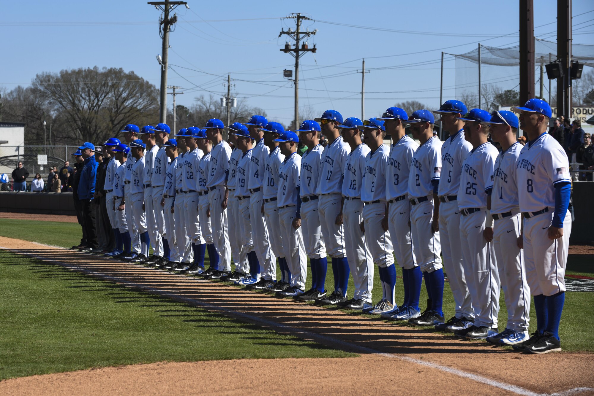 The Air Force Academy Falcons baseball team lines up during the playing of the National Anthem, Feb. 27, 2016, in Kinston, North Carolina. The three-game series took place at the Historic Grainger Stadium against the Naval Academy. (U.S. Air Force photo/Airman Shawna L. Keyes) 