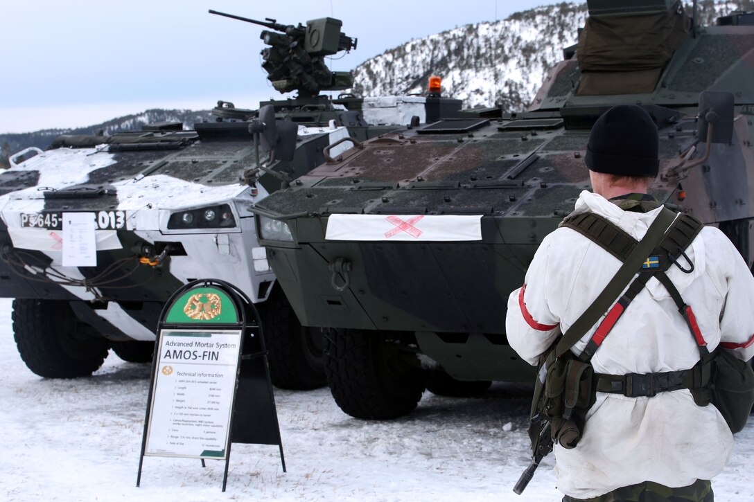A Swedish soldier waits to present the capabilities of an armored personnel carrier on display in Namsos, Norway, March 1, 2016, during Distinguished Visitor Day as part of Exercise Cold Response 16. Distinguished Visitor Day provided high-ranking personnel from all 13 participating countries an overview of the scope, intent and capabilities achieved through integration of personnel and equipment among NATO allies and partners nations. During Cold Response, more than 15,000 troops will work together, learn from each other and sustain and strengthen partnerships, operational capabilities, and coordination.