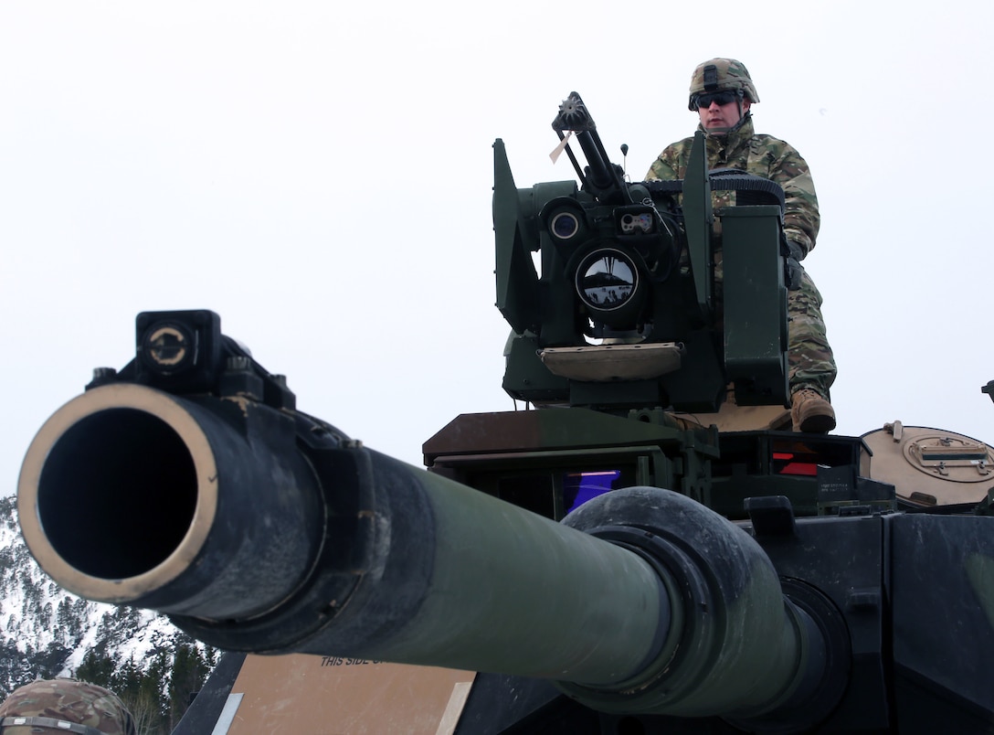 A U.S. Army soldier presents the capabilities of an M1A2 tank on display in Namsos, Norway, March 1, 2016, during Distinguished Visitor Day as part of Exercise Cold Response 16. Distinguished Visitor Day provided high-ranking personnel from all 13 participating countries an overview of the scope, intent and capabilities achieved through integration of personnel and equipment among NATO allies and partners nations. During Cold Response, more than 15,000 troops will work together, learn from each other and sustain and strengthen partnerships, operational capabilities, and coordination.