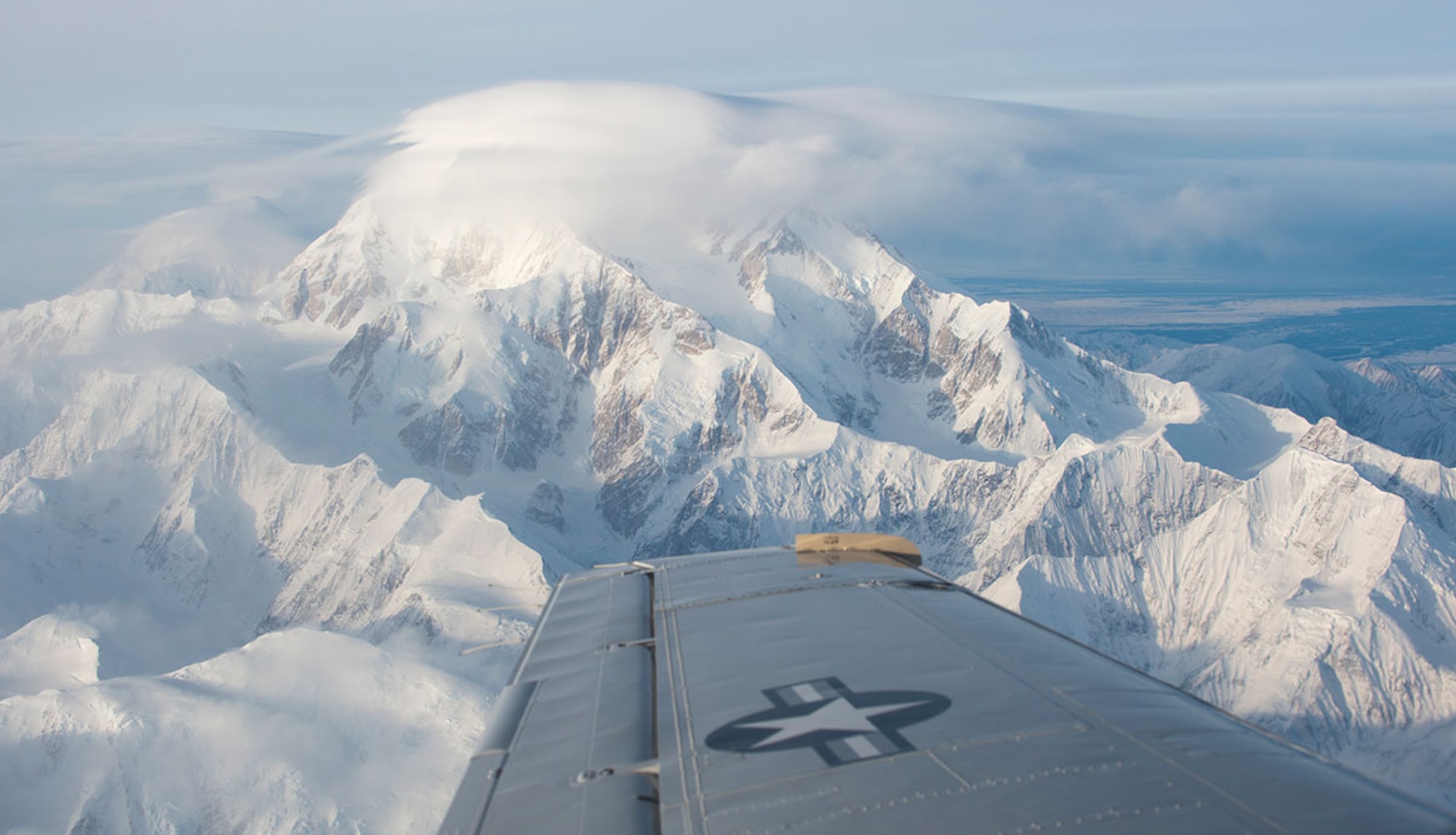 A C-12F Huron flies near Denali during a C-12 site pilot training mission visiting two remote locations in Alaska, Feb. 23, 2016. The pilots have to complete training which includes about 30 hours of flying, landing, training, and instructor-supervised landing at each of the seven remote long-range radar sites. The Huron is assigned to the 517th Airlift Squadron at Joint Base Elmendorf-Richardson, Alaska. (U.S. Air Force photo/Staff Sgt. Sheila deVera)
