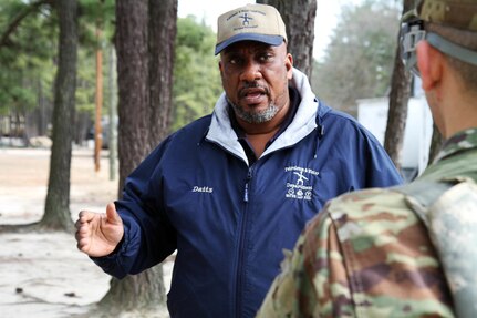 Russell Datts, civilian contractor and instructor at the 94th Training Division's Petroleum Supply Specialist Reclassification Course, teaches fuel testing techniques in the field at Fort Lee, Va.