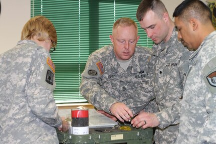 Students of the 94th Training Division's Petroleum Supply Specialist Reclassification Course at Fort Lee, Va., work as a team organizing and inventorying a test kit before moving from the classroom to the field to begin fuel testing as they learn the fundamentals of being a fueler.