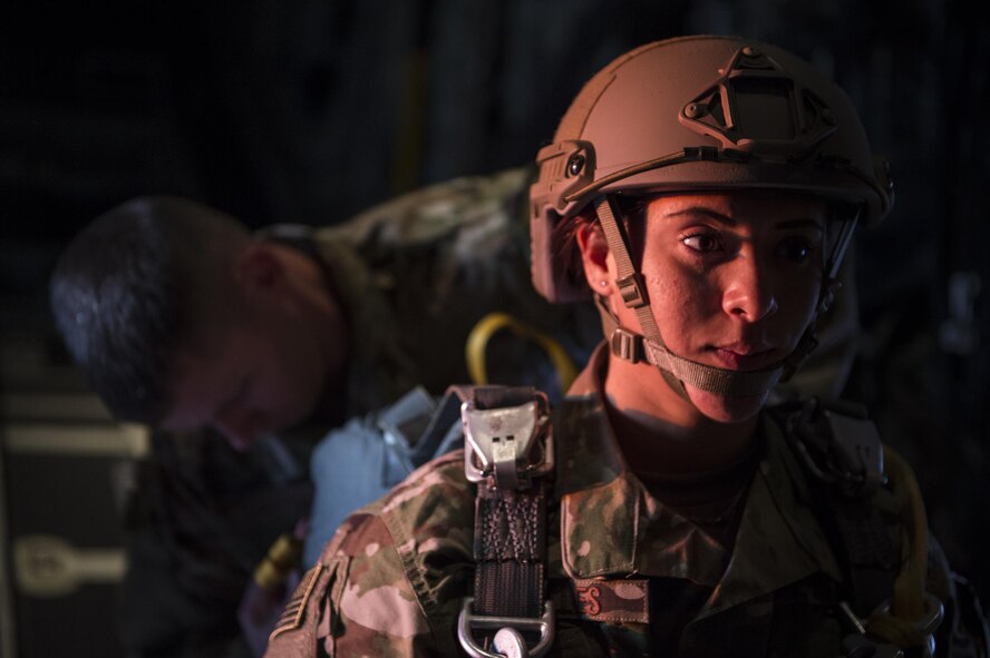 U.S. Air Force Airmen from the 820th Base Defense Group prepare for personnel drops in the back of an HC-130J Combat King II, Feb. 18, 2016, in the skies over South Ga. Multiple U.S. Air Force aircraft within Air Combat Command conducted joint aerial training at Grand Bay Bombing and Gunnery Range. During the training, the aircraft conducted tactical air and ground maneuvers, as well as weapons training. (U.S. Air Force photo by Senior Airman Ryan Callaghan/Released)