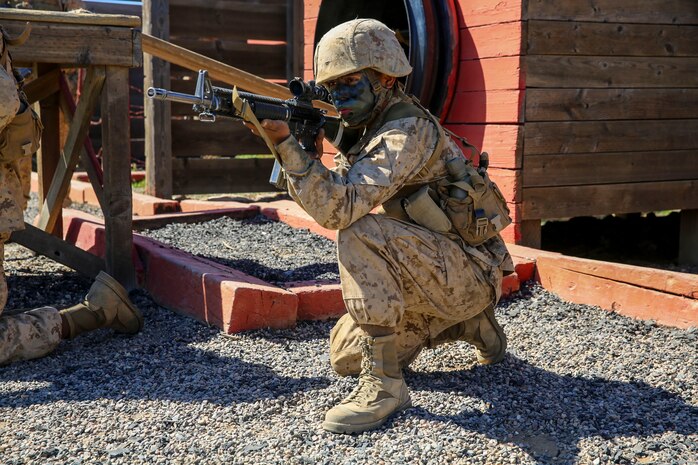 Private First Class Armando Sajbin, Echo Company, 2nd Recruit Training Battalion, posts as security during the Crucible at Marine Corps Base Camp Pendleton, Calif., Feb. 24. Each obstacle required recruits to provide security for the rest of their fire team to simulate protecting them from the enemy during combat situations. Annually, more than 17,000 males recruited from the Western Recruiting Region are trained at MCRD San Diego.