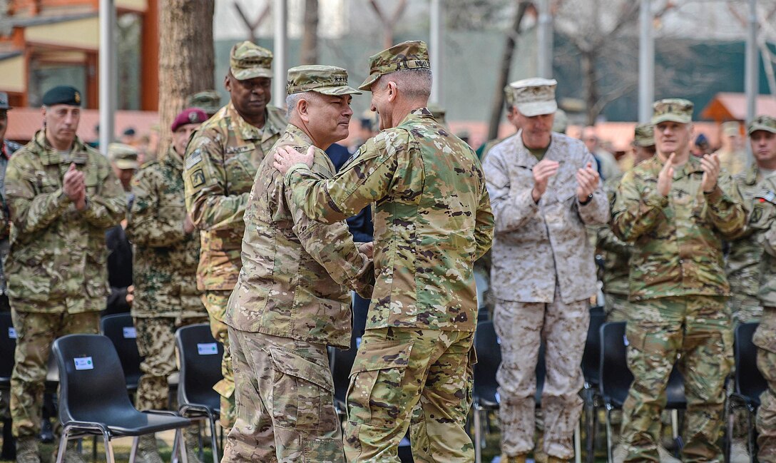 Army Gen. John F. Campbell, left, outgoing commander of U.S. Forces Afghanistan and NATO’s Resolute Support Mission, and Army Gen. John W. Nicholson Jr., incoming commander, shake hands other after a change-of-command ceremony in Kabul, Afghanistan, March 2, 2016. Marine Corps Gen. Joseph F. Dunford Jr., right, chairman of the Joint Chiefs of Staff, and Army Gen. Lloyd J. Austin III, left, commander of U.S. Central Command, attended the ceremony. Air Force photo by Staff Sgt. Tony Coronado