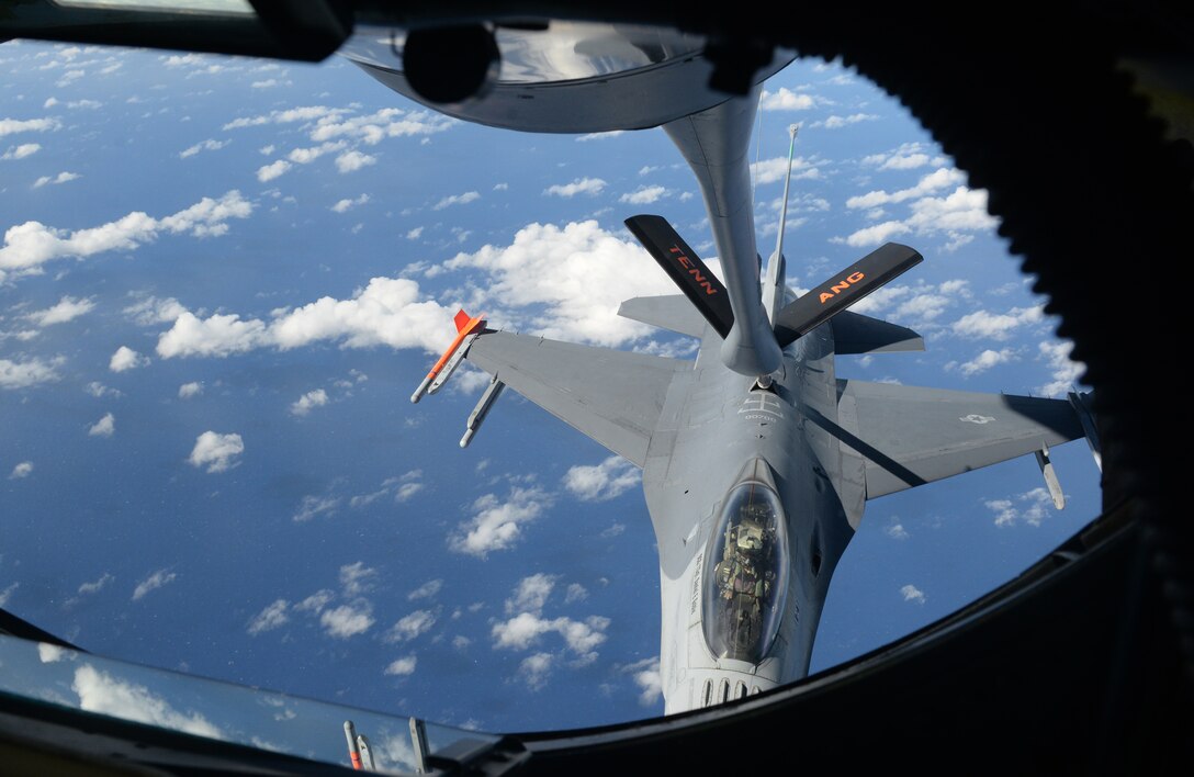 A F-16 Fighting Falcon, piloted by Maj. Curtis Voltz, 112th Expeditionary Fighter Wing, Ohio Air National Guard chief of weapons and tactics, receives fuel from a 134th Air Refueling Wing, Tennessee ANG KC-135 Stratotanker, Feb. 2, 2016, over the Pacific Ocean. Deployed here as part of the Theater Security Package, the 112th EFS provides combat fighter assets to augment forces already operating in the Pacific theater. (U.S. Air Force photo/Senior Airman Joshua Smoot)