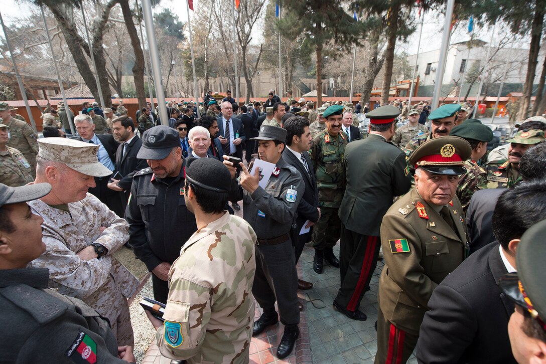 Marine Corps Gen. Joseph F. Dunford Jr., left, chairman of the Joint Chiefs of Staff; talks with Afghan military leaders after a change-of-command ceremony on Camp Resolute Support in Kabul, Afghanistan, March 2, 2016. During the ceremony, Army Gen. John W. "Mick" Nicholson Jr. assumed command. DoD photo by D. Myles Cullen