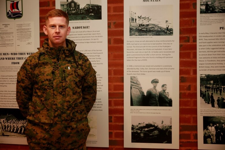 1st Lt. Arthur Colby, a logistics officer with 2d Marine Expeditionary Force, stands next to a display in Værnes commemorating the actions of the 99th Infantry Battalion during World War II in Norway. Maj. William Colby, Arthur’s grandfather, led a group of men from the battalion during Operation Rype in sabotage missions aimed at preventing German troops from moving in Norway during the war.