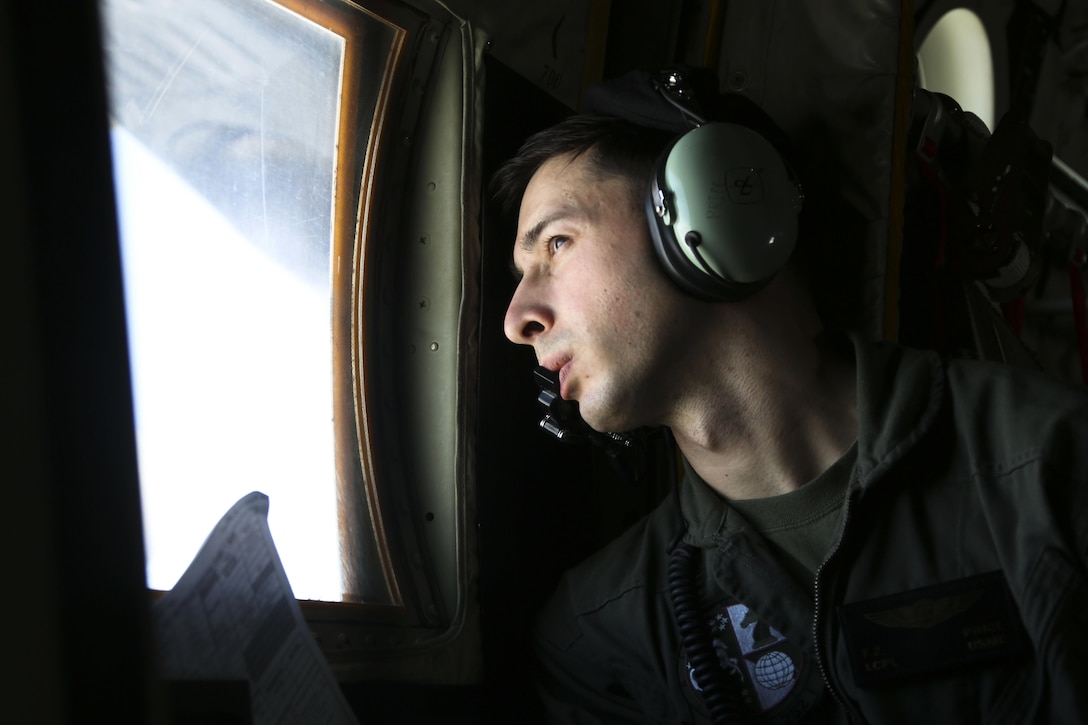 A crew master observes as four EA-6B Prowlers belonging to each Prowler squadron aboard Marine Corps Air Station Cherry Point conducted a "Final Four" division flight aboard the air station March 1, 2016. The "Final Four" flight is the last time the Prowler squadrons will be flying together before the official retirement of Marine Tactical Electronic Warfare Training Squadron 1 at the end of Fiscal Year 16 and the eventual transition to "MAGTF EW". MAGTF EW is a more distributed strategy where every platform contributes to the EW mission, enabling relevant tactical information to move throughout the electromagnetic spectrum and across the battlefield faster than ever before. (U.S. Marine Corps photo by Cpl. N.W. Huertas/Released)