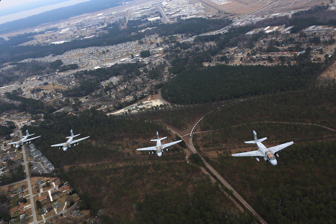 Four EA-6B Prowlers belonging to each Prowler squadron aboard Marine Corps Air Station Cherry Point conducted a "Final Four" division flight aboard the air station March 1, 2016. The "Final Four" flight is the last time the Prowler squadrons will be flying together before the official retirement of Marine Tactical Electronic Warfare Training Squadron 1 at the end of Fiscal Year 16 and the eventual transition to "MAGTF EW". MAGTF EW is a more distributed strategy where every platform contributes to the EW mission, enabling relevant tactical information to move throughout the electromagnetic spectrum and across the battlefield faster than ever before. (U.S. Marine Corps photo by Cpl. N.W. Huertas/Released)