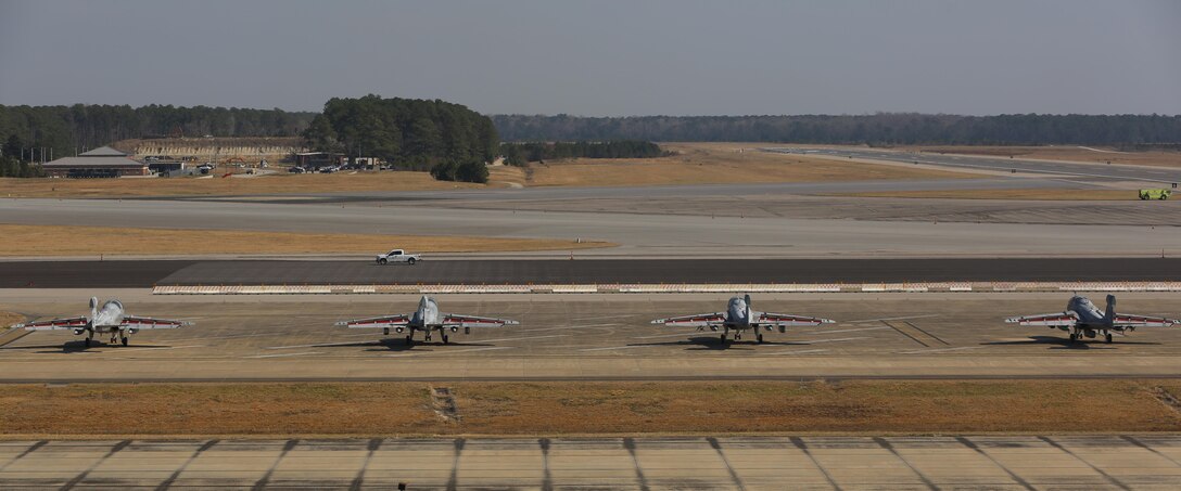 Four EA-6B Prowlers belonging to each Prowler squadron aboard Marine Corps Air Station Cherry Point conducted a "Final Four" division flight aboard the air station March 1, 2016. The "Final Four" flight is the last time the Prowler squadrons will be flying together before the official retirement of Marine Tactical Electronic Warfare Training Squadron 1 at the end of Fiscal Year 16 and the eventual transition to "MAGTF EW". MAGTF EW is a more distributed strategy where every platform contributes to the EW mission, enabling relevant tactical information to move throughout the electromagnetic spectrum and across the battlefield faster than ever before. (U.S. Marine Corps photo by Lance Cpl. Mackenzie Gibson/Released)
