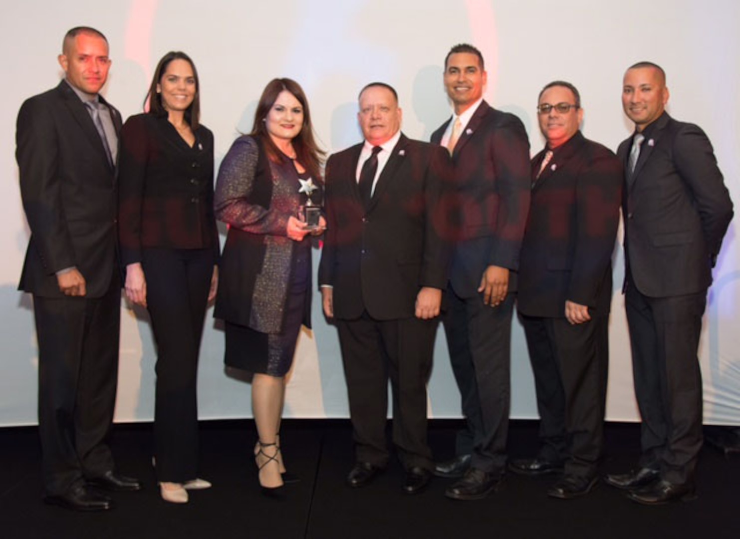 National Guard ChalleNGe Nationwide Program Director Matilde Almodovar, shown with her staff, was honored Feb. 23, 2016, in Washington, D.C. 