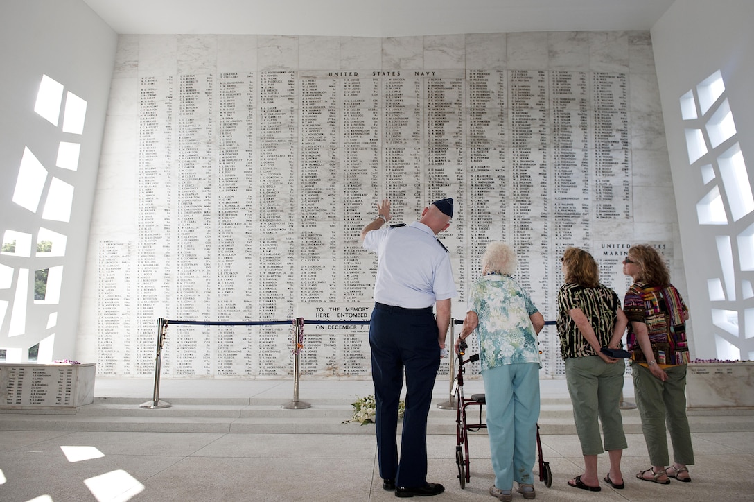 Air Force Col. David Kirkendall, the commander of the 647th Air Base Group and the deputy commander of Joint Base Pearl Harbor-Hickam, tours the USS Arizona Memorial at Pearl Harbor, Hawaii, with Kathryn L. Miles, a World War II Women Airforce Service Pilot, and her daughters, Beth Tillinghast and Anne Miles, June 6, 2014. WASPs performed noncombat missions to enable male pilots to fill combat roles in the war effort. Air Force photo by Staff Sgt. Christopher Hubenthal