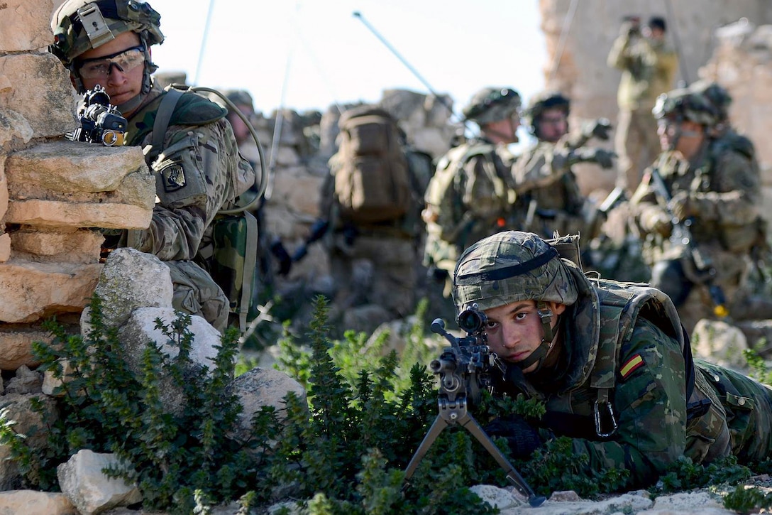 A U.S. Army paratrooper and a Spanish soldier secure the perimeter of a building during the Sky Soldier 16 training exercise at Chinchilla Training Area in Albacete, Spain, Feb. 29, 2016. The paratrooper is assigned to the 173rd Airborne Brigade and the Spanish soldier is assigned to the Spanish Armed Forces Airborne Brigade. Army photo by Staff Sgt. Opal Vaughn



