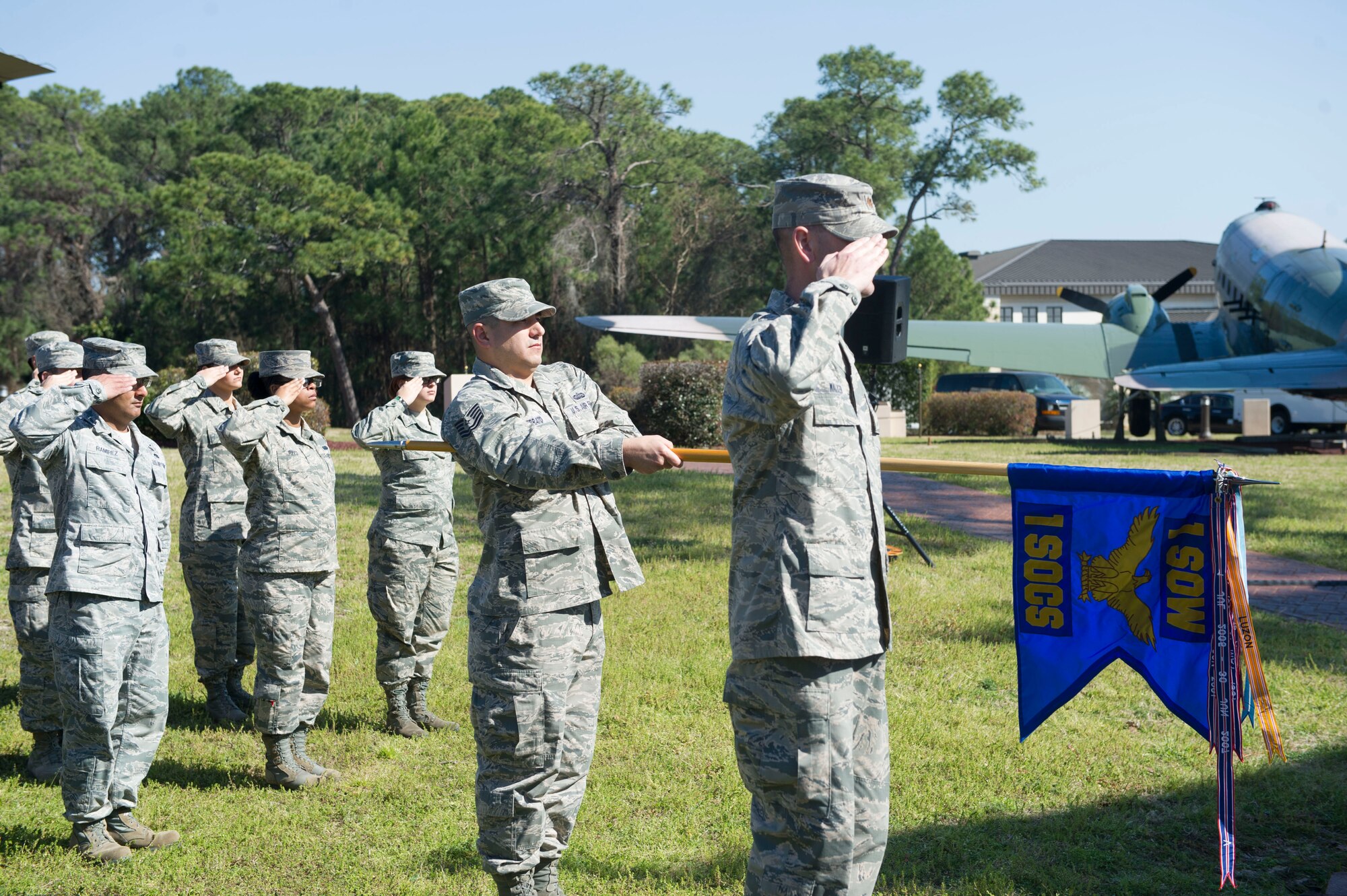 Airmen with the 1st Special Operations Communications Squadron render a final salute to Lt. Col. Jason Fick, former commander of the 1st SOCS, during a change of command ceremony at Hurlburt Field, Fla., Feb. 26, 2016. Fick relinquished command to Lt. Col. Scott McGovern. (U.S. Air Force photo by Senior Airman Krystal M. Garrett)