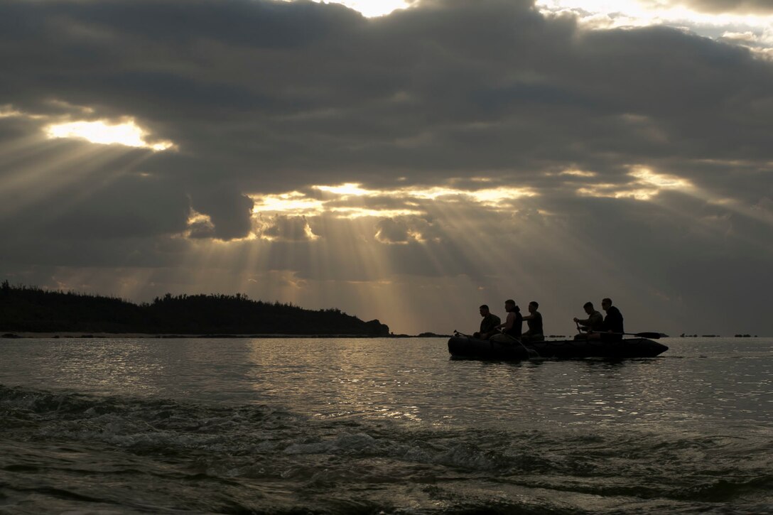 Marines with 3rd Reconnaissance Battalion test a Combat Rubber Raiding Craft March 1, at Kin Blue, Okinawa, Japan. The JGSDF members observed Marines from 3rd Recon Bn, 3rd Marine Division, III Marine Expeditionary Force, practice scout swimmer techniques and conduct raid missions.